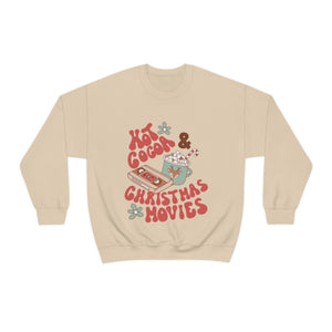 Hot Cocoa and Christmas Movies Crewneck sweatshirt featuring a sage green cup of hot cocoa topped with marshmallows and a candy cane alongside an old-school vhs tape 